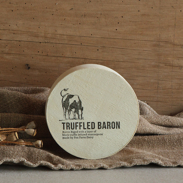 Our truffled Baron Bigod cheese (approximately 250g) with a layer of our own milk mascarpone, infused with the finest black truffles. Your cheese will be hand wrapped in wax paper and packed in its own beautiful wooden box. Made by Fen Farm Dairy