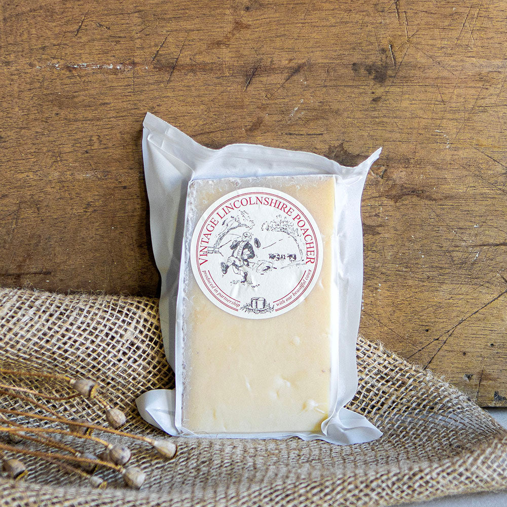 Lincolnshire Poacher is the beautiful love-child of a West Country Cheddar and an Alpine hard cheese, combining the very best elements of both. A hard cow’s milk cheese, it was developed by 4th generation farming brothers Simon and Tim Jones, and is now made by their head cheesemaker Richard, on their idyllic dairy farm on the edge of the Lincolnshire Wolds.