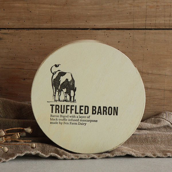 Our truffled Baron Bigod cheese (approximately 1kg) with a layer of our own milk mascarpone, infused with the finest black truffles. Your cheese will be hand wrapped in wax paper and packed in its own beautiful wooden box. Made by Fen Farm Dairy