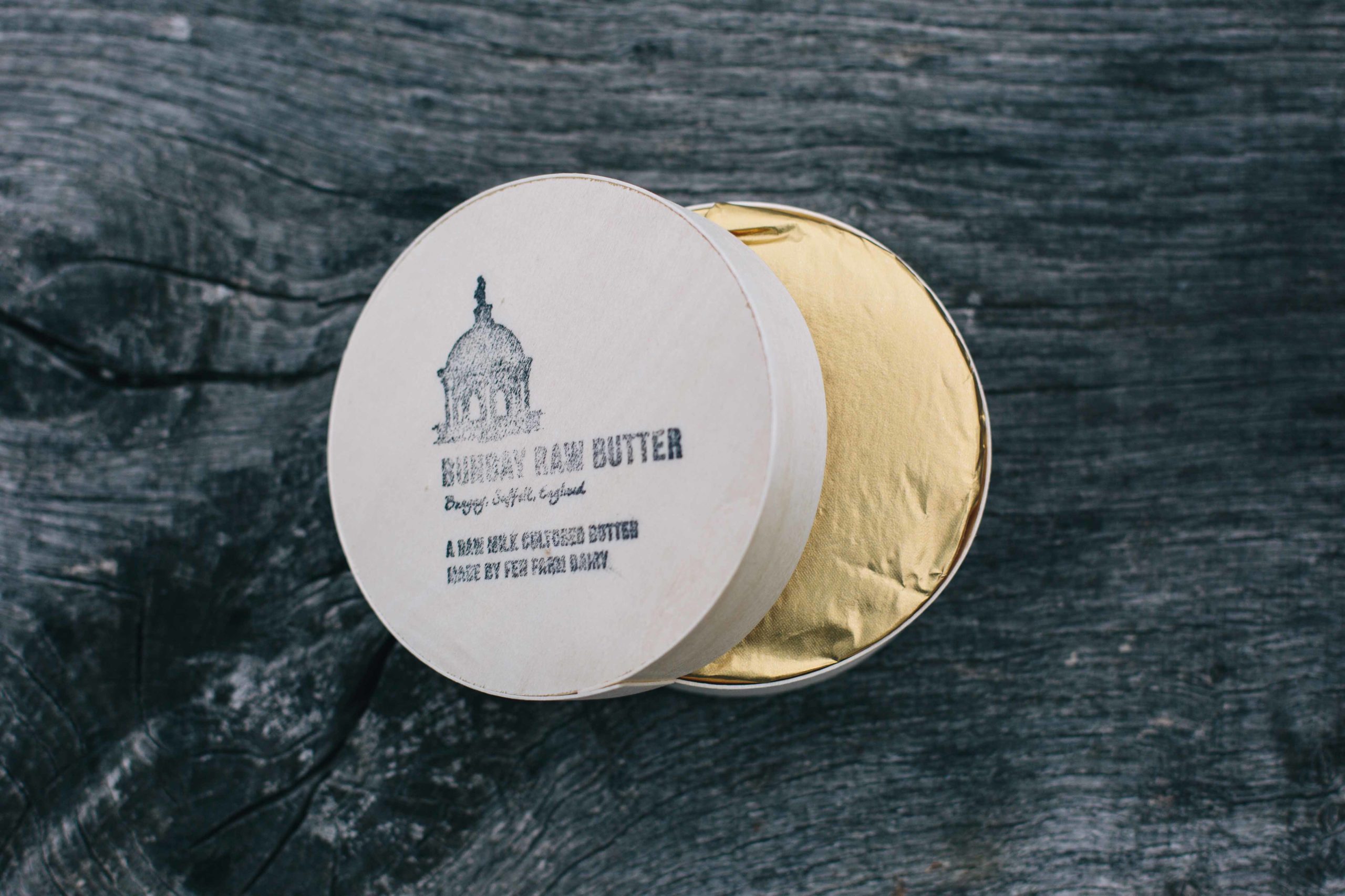 A wooden package of our delicious raw butter